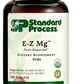 Image of E-Z Mg bottle next to tablets of magnesium supplements.